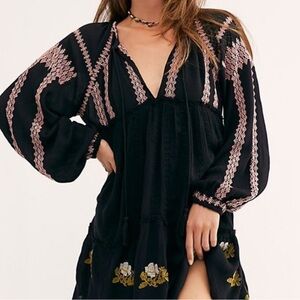 Boho Eyelet Dress with embroidered pink tribal trim; floral print along bottom